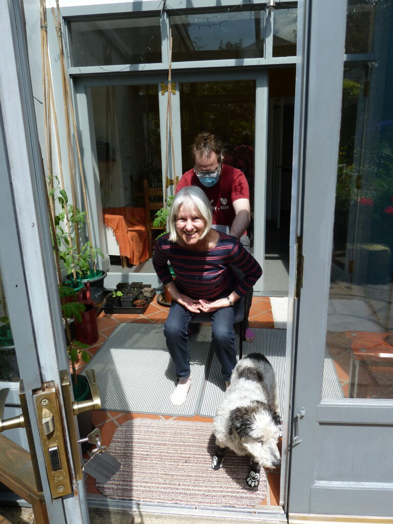 Visiting teacher Charlotte Woods working with Edinburgh Alexander Training School trainee standing and sitting