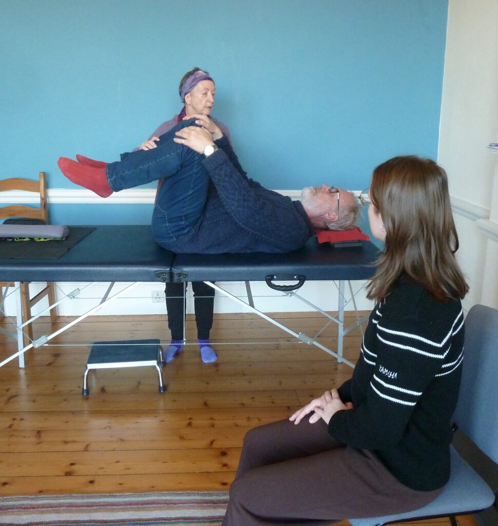 Photo of Alexander teacher doing table work with a trainee
