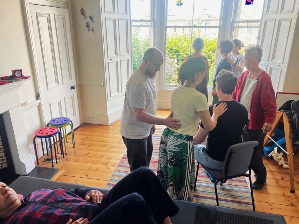Photo of trainees and teachers at Edinburgh Alexander Training School doing hands-on work
